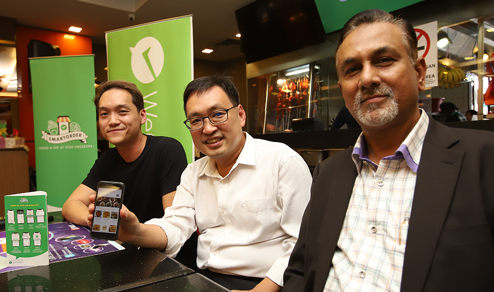 (From left) WeChat Pay MY CEO Jason Siew; Deputy Minister of Domestic Trade and Consumer Affairs Chong Chieng Jen; and Syed Group chairman Syed Jamarulkhan MS Kadir