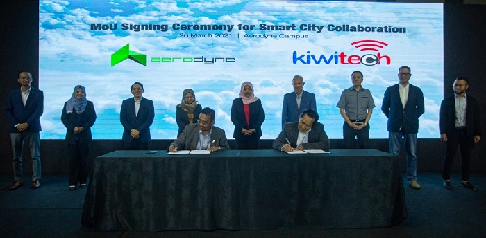 Aerodyne Group founder & CEO, Kamarul Muhamed (left) signing the MOU with Azrin Abu Bakar, Kiwitech CEO. Each party will leverage on the other's strengths to deliver smart city surveillance.
