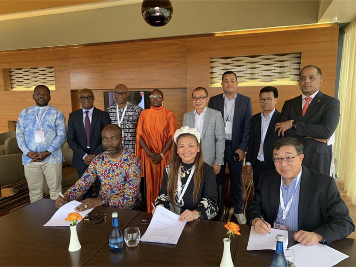 Amor Maclang (bottom row, centre) of DP, OAFM, GIFT-ASEAN together with David Lee (bottom row, right) of GFI, and Patrick Saidu Conteh (bottom row left) of AFN signs the partnership agreement witnessed by movers and shakers from ASEAN and Pan Africa's fintech ecosystem.