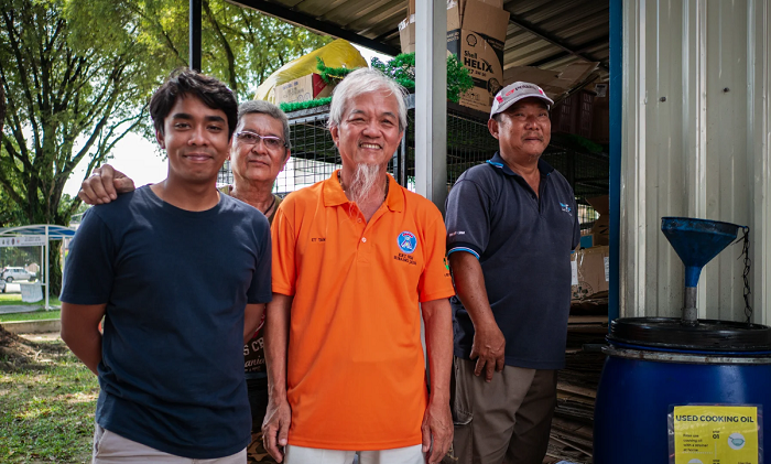Syazwan (left) in 2017 with like-minded neigbours conscious about the environment. His three years of investing Saturday mornings spent collecting recyclables helped him identify Used Cooking Oil as the right market segment to go into.