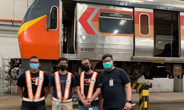Asia Mobiliti engineers in front of a KTMB rolling stock.