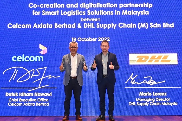 Idham Nawawi (left), Chief Executive Officer of Celcom and Mario Lorenz, Managing Director of DHL Supply Chain (Malaysia) Sdn Bhd.