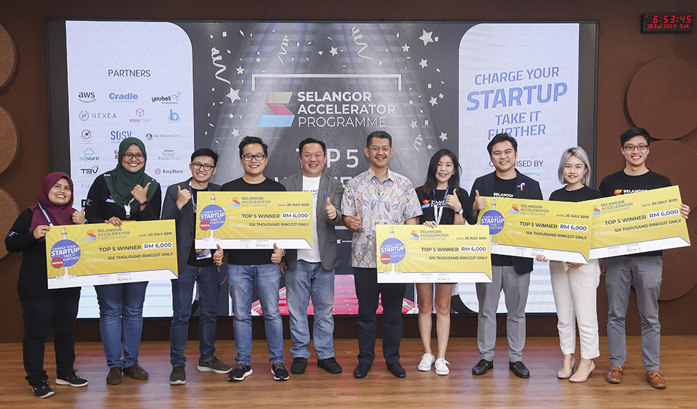 The top five startups in SAP 2019 (from left) Petotum; PrimeXcess; Sitec chief executive Yong Kai Ping; Invest Selangor CEO Hasan Azhari Idris; Engage Blink; Carpit, and Kravve