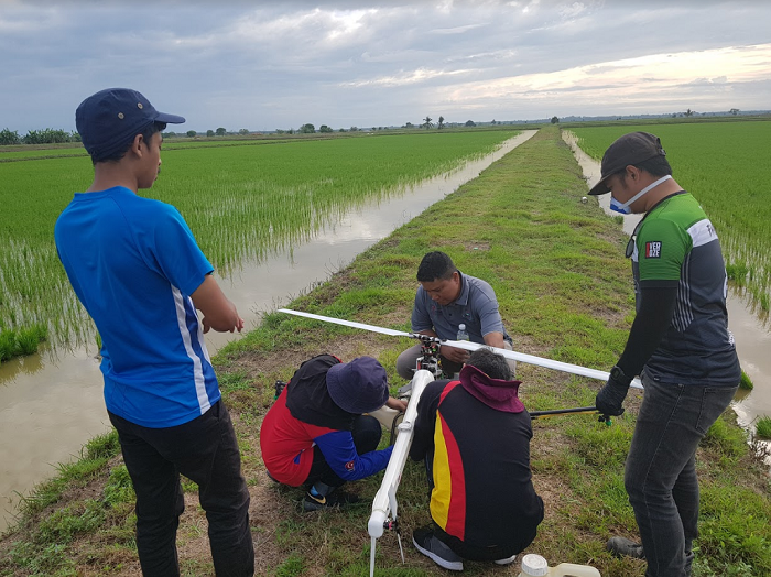 ATP trainees from the FELCRA community performing the pre-flight checks for the Alpas II drone.