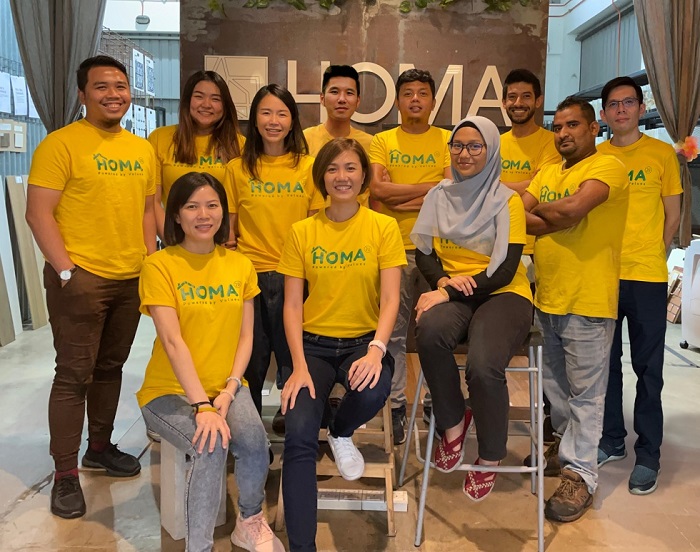 HOMA2U founder and CEO, Pennie Lim (seated, 2nd from left) with her team.