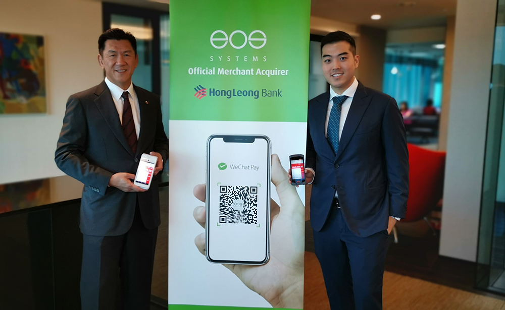 Hong Leong Bank Personal Financial Services MD Charles Sik (left), with EOS Systems CEO Leong Khai Ric