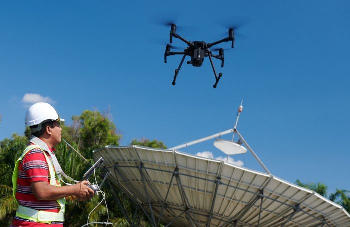 A Maxis engineer uses drones to inspect its network.