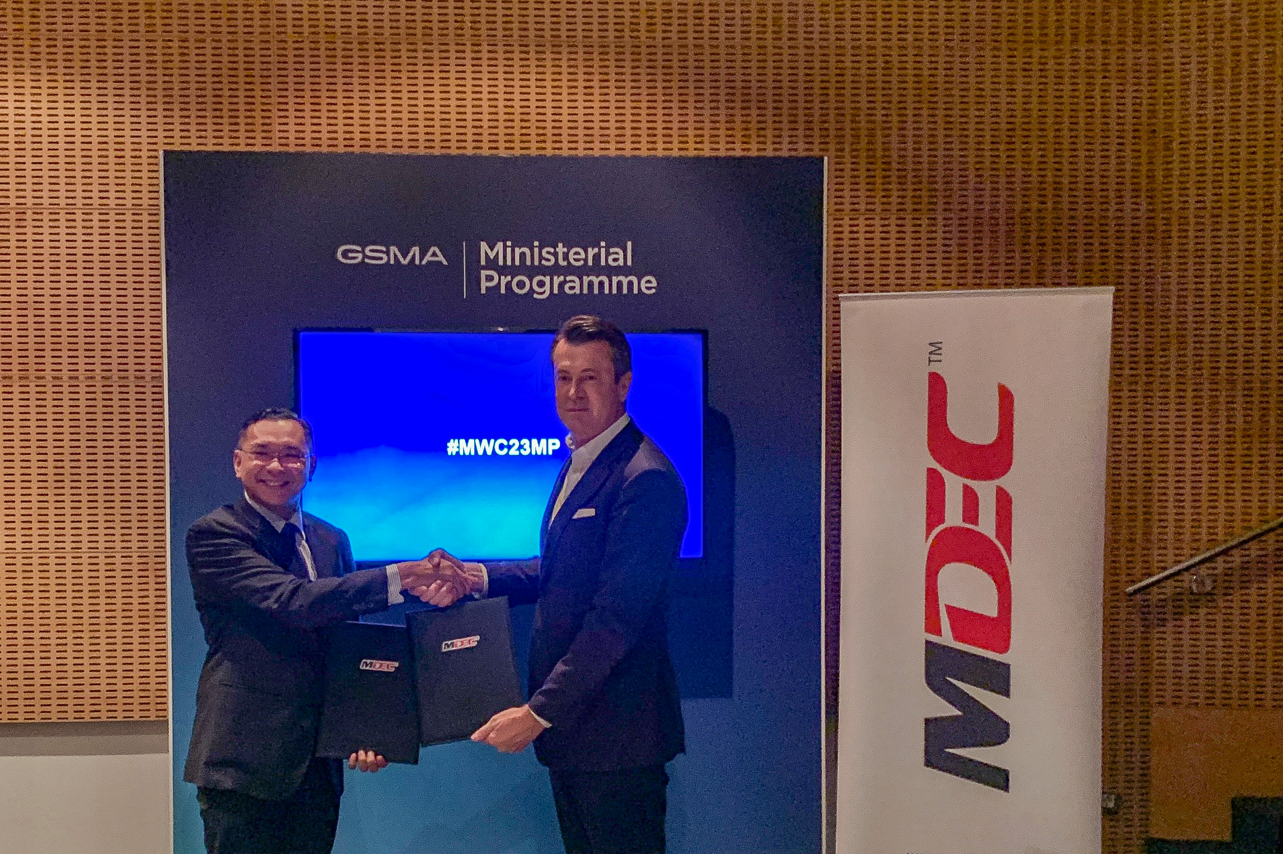 MDEC CEO Mahadhir Aziz (left) and GSMA head of APAC Julian Gorman at MWC 2023 in Barcelona, Spain.