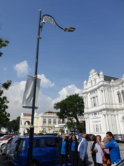 (3rd from left) Jagdeep Singh Deo, Penang EXCO for Local Government, Housing and Town & Country Planning points to a Terragraph box located on a street light in Georgetown, Penang.