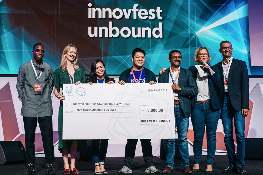 Representatives of Indonesian startup Kora accepting their cash prize